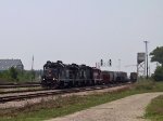 NCYR 8330 leads a train making a pickup 